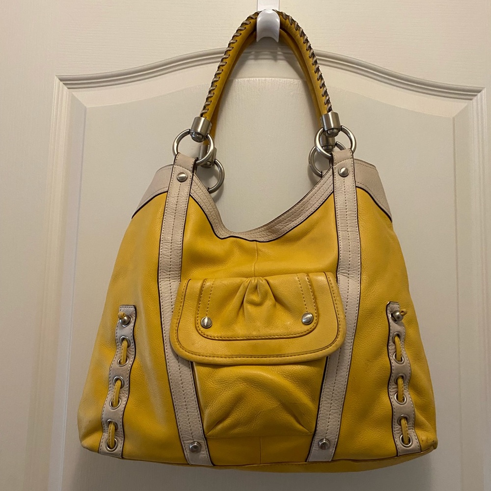 B. Makowsky yellow shoulder bag